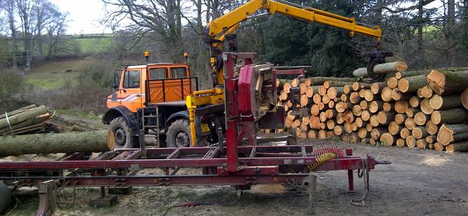 The Serra mill being loaded by Unimog at Escot Park Devon